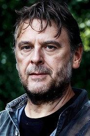 Gilly Gilchrist as Principal Officer Scott in Starred Up 2014