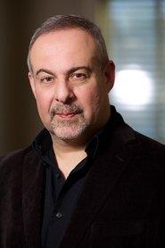 Alain Dahan as Tom Cooley in Roy: A Brother's Journey 2022