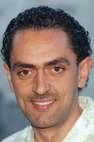 Ashraf Telfah as Anwar in Oversized Coat 2013