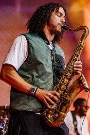 James Mollison as Self : Saxophone in Ezra Collective Ground Control 2023
