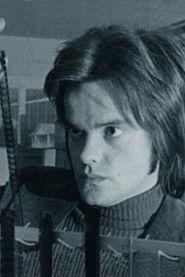 Roger Watkins as Man at Police Headquarters in Spine 1986