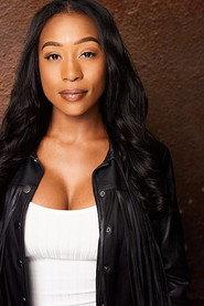 Ashley Cacho as Tracie Hawkins in A Holiday Change 2019