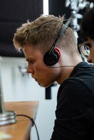Dylan MacGregor as RADIO GUARD in HARDDRIVE 2025