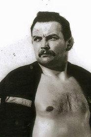Roger Delaporte as Self - Wrestling Match on TV (uncredited) in Marie-Octobre 1959