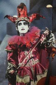 Közi as Self - Guitar, Synthesizer in MALICE MIZER: merveilles ~Shuuen to Kisuu~ l'espace 1998