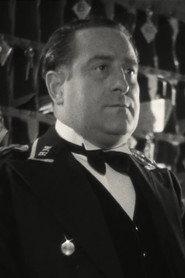 Philippe Olive as Mr. Matignon, Evelyne's producer in The Red Rose 1951