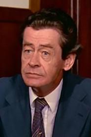 Dennis Bourke as Reporter at Phonebooth in Prisoner of Rio 1988