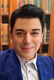 Malan Breton as Mr. Sebastian in College Debts 2015