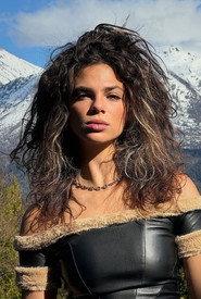 Melanie Almuina as Eva (post-elixir) in The Invasion from Planet X-tasis 2025