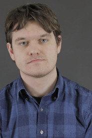 Alex O’Brien as Barman in Baptism Troubles 2024