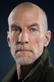 Marti Matulis as Mr. Clock in Killing Time 2019