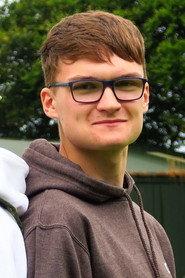 Ben Davidson as Nightclub Owner / Police Dispatcher in The Bloody Savanna 2022
