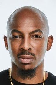 Travon McCall as News Anchor in The Accidental Getaway Driver 2025