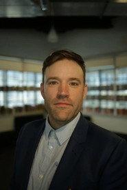 Chris Mitchell as Security guard in The Late Turn 