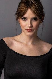 Bennett Welch as Emma in Hostile Takeover 2024