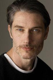 Adam Forster as Phil in End of the Line 2023