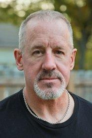 Brian Smyj as Coach Miller in The Maneken