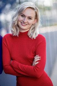 Samantha Girard as Woman #1 in Behind the Red Curtain 2022