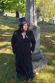 E.F. Grimm as Katt Butler in Death Receipt 