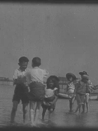 Children Playing on the Beach at Rhyl (1898) poster