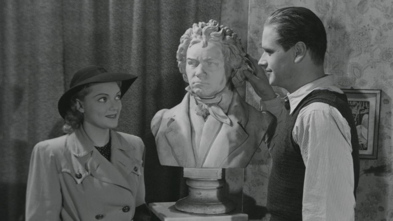 A Gentleman in Top Hat and Tails 1942 movie scene