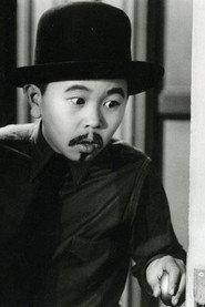 Layne Tom Jr. as Charlie Chan Jr in Charlie Chan at the Olympics 1937