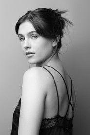 Romina Poza as Paola (young) in A Not So Merry Christmas 2022
