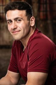 Chris Tarpos as Server (uncredited) in The Christmas Chalet 2019
