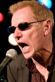 Robert Kane as Vocals & harmonica in Dr. Feelgood: Live in London 2005
