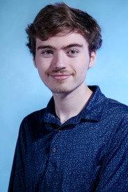 Jason McCluskey as Chris/Police Officer in The Santa Fraus 2025