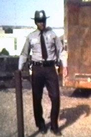 Raymond Goodall as Police officer in Portrait of an Assassin 1983