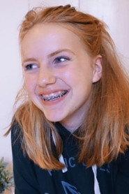 Lizzy van Vleuten as Girl at fish stall in My Extraordinary Summer with Tess 2019