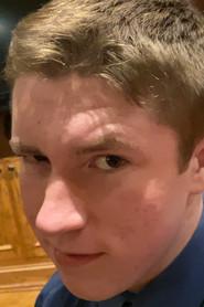 Noah Bowman as The Scientist / Box Boy in The Box Boy 2: A Christmas Meltdown 2023