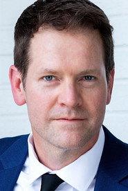 Mark E. Holmes as Father Elias in Santa-N the Red Awakening 2025