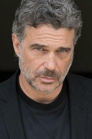 Ron Cobert as Elrey in Forbidden Highway 2001