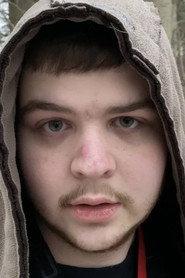 Eric King as Monkey Box / Eric in The Box Boy 2: A Christmas Meltdown 2023