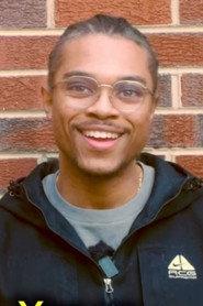 Louis Rivers as Podcaster in MONDAY 2026