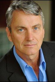 Michael McKenzie as Bruce Wendolyn in Breed of Greed 2025
