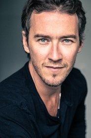 Guillaume Faure as Nicolas in Dans l'ombre des dunes 2022