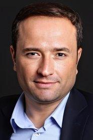 Ertan Gül as Accountant in Brother's Keeper 2021