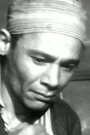Mohammed Tawfik as Morsy the barber in El Zuhur El Fatina 1952