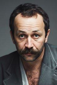 Yaman Okay as Türkmen in Journey of Hope 1990
