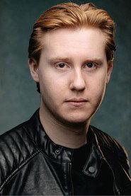 Thomas Jenkinson as Mike in GREED 2026